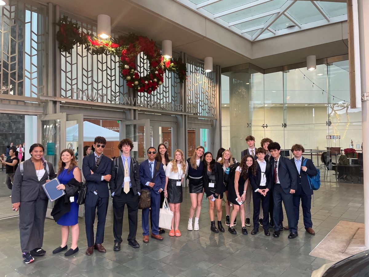 Hawaii students gathered at a Model UN conference in formal attire