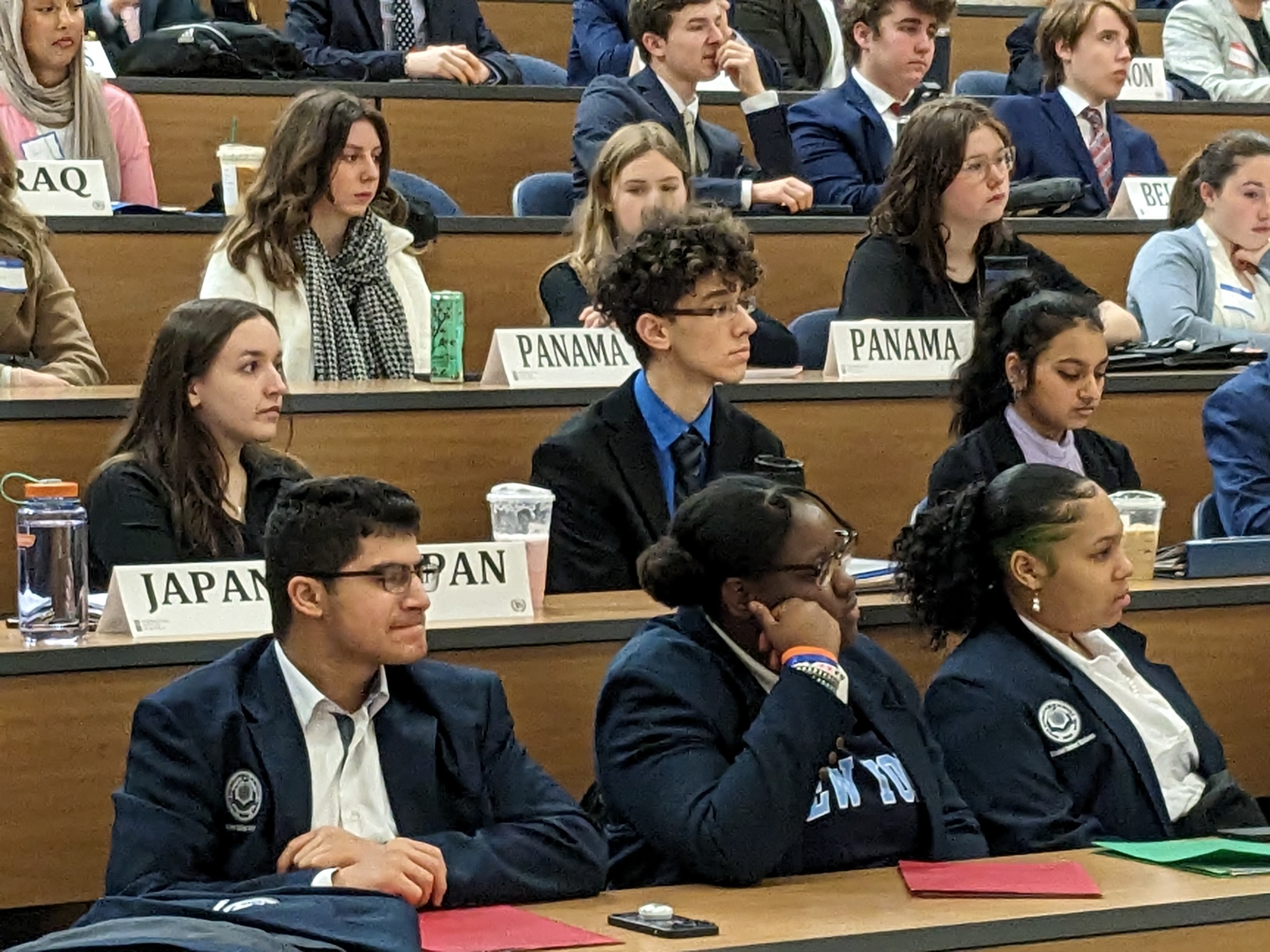 Students engaged in Model UN committee debate and discussion